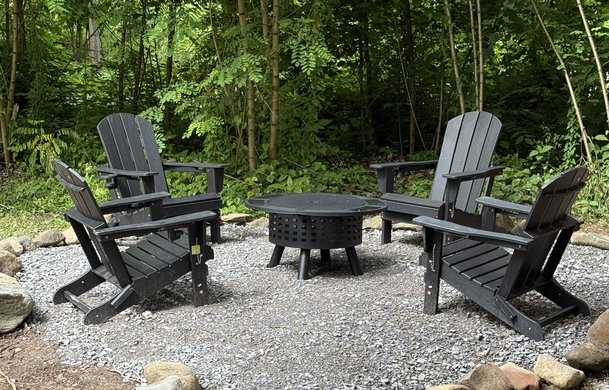 Smoky Hollow Signature Cabin private fire pit area with Adirondack chairs at Adventure Bound Gatlinburg