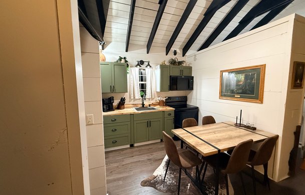 Smoky Hollow Signature Cabin kitchen and dining area at Adventure Bound Gatlinburg