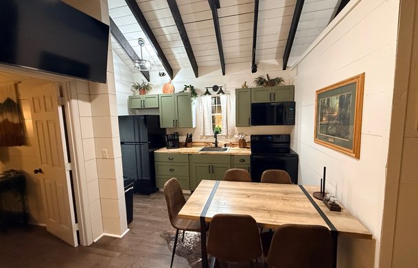 Smoky Hollow Signature Cabin open-concept living space at Adventure Bound Gatlinburg