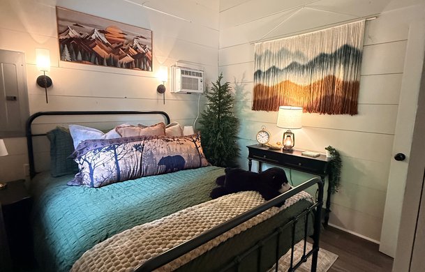 Smoky Hollow Signature Cabin master bedroom at Adventure Bound Gatlinburg