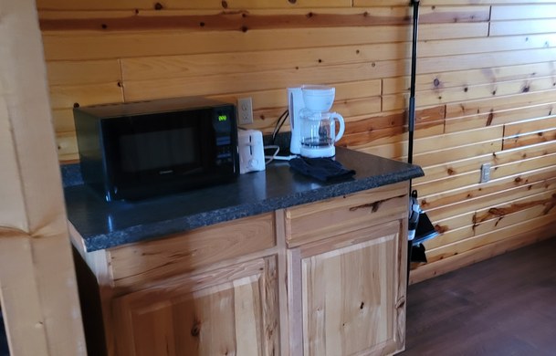 accessible family cabin kitchen counter with microwave and coffee maker at Adventure Bound Beaver Trails